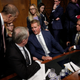 Republican members of the Senate Judiciary Committee surround Sen. Jeff Flake (C) (R-AZ) after he announced he was in favor of a delay in the Kavanaugh nomination process during a committee meeting in the Dirksen Senate Office Building on Capitol Hill September 28, 2018 in Washington, DC.